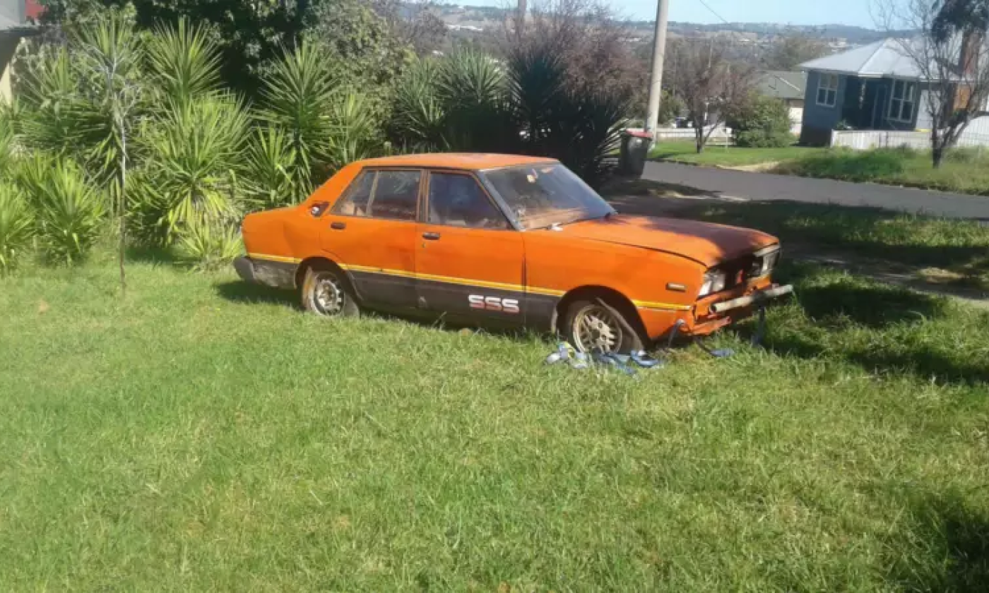 1982 Datsun Stanza SSS sedan red unrestored rusty NSW 2021 (1).png
